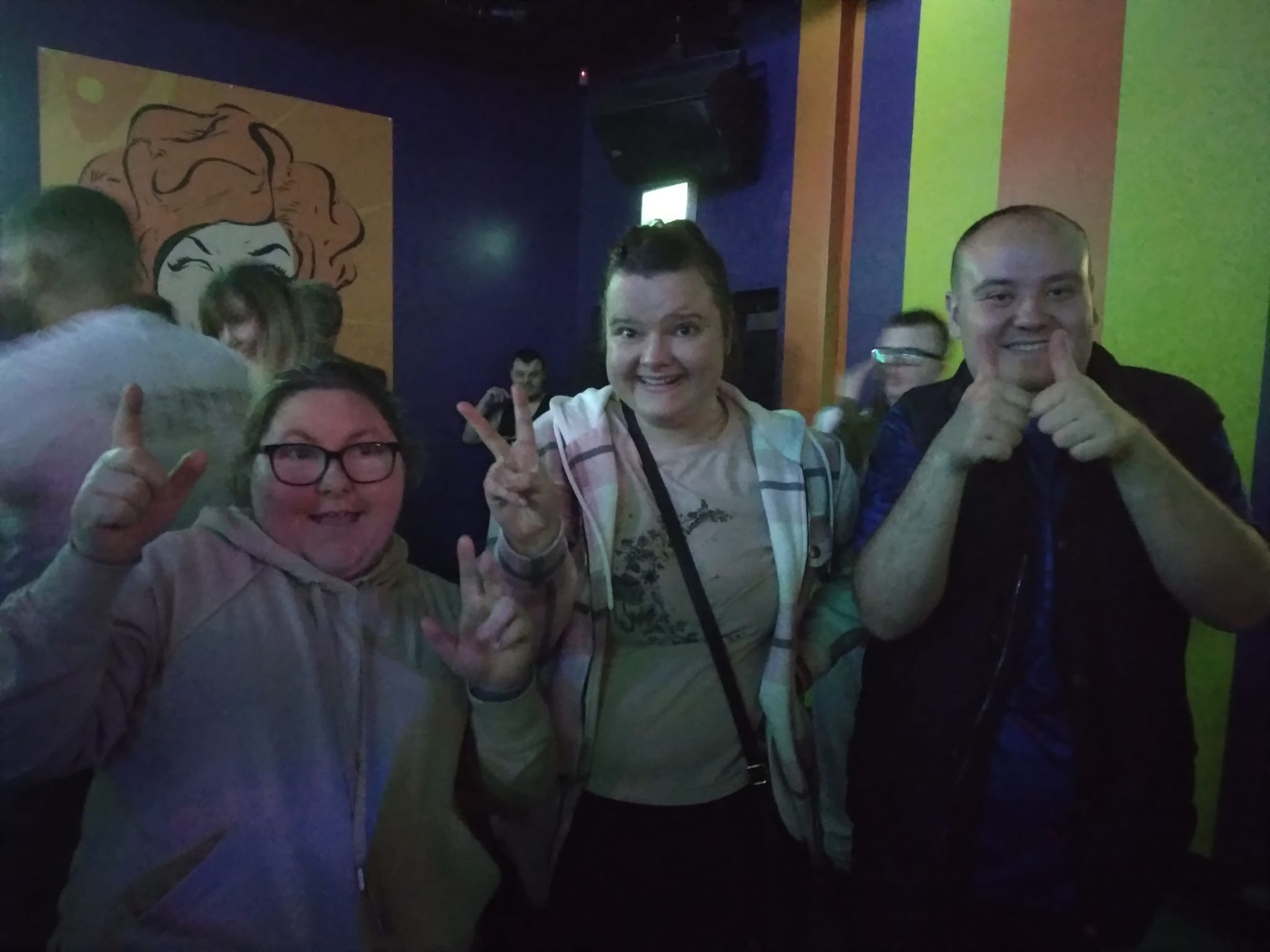 A photo of three people posing at one of our Club Nights